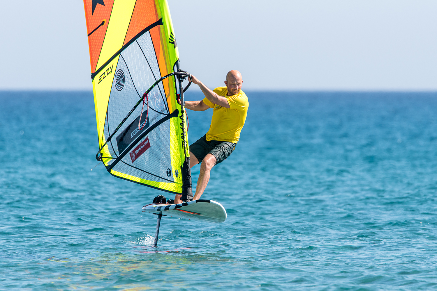 Foiling into tacks are fun and a great skill builder; rake the rig back, as the hips swing forward, carve into the wind, and keep that nose up as far as you can.