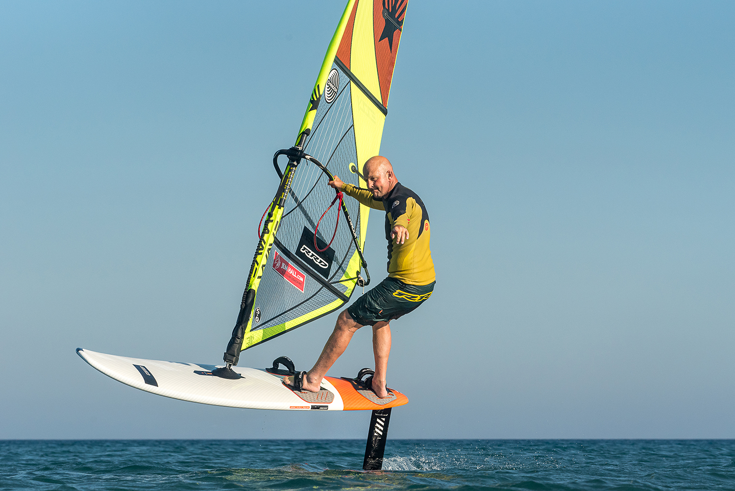 Top turn: Keep the sail open, bring it forward, look upwind, keep the ride height stable with your back foot pressure and carve off your heels. You can do many of these turns, they are fun and really build your skills.